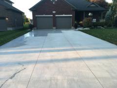 Lane way all finished, applying sealant to protect the concrete's  finish.