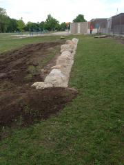 Natural stone retaining wall for garden.