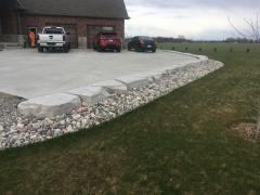 Small retaining wall armour stone for border to driveway.