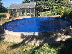 24' Round on ground pool filled with water ready for building deck.
