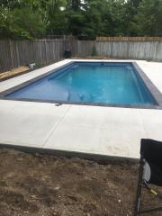 Nice in-ground fibreglass pool installed after lifted over house.